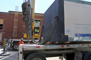 Elevator installation requires rigging the crane to the modular elevator.